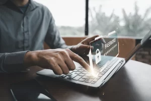 Man types in password to secure website with lock icon